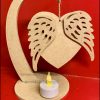 Stand with angel heart and t light